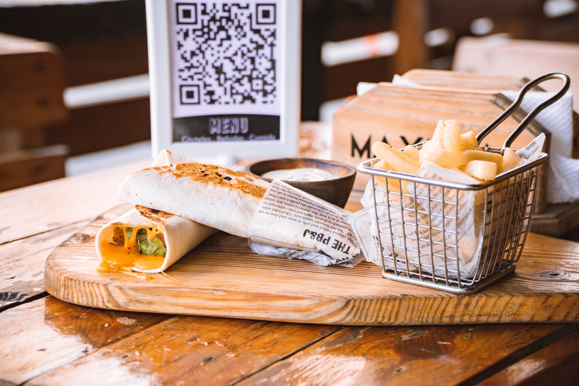 bread basket and qr code menu sitting on table