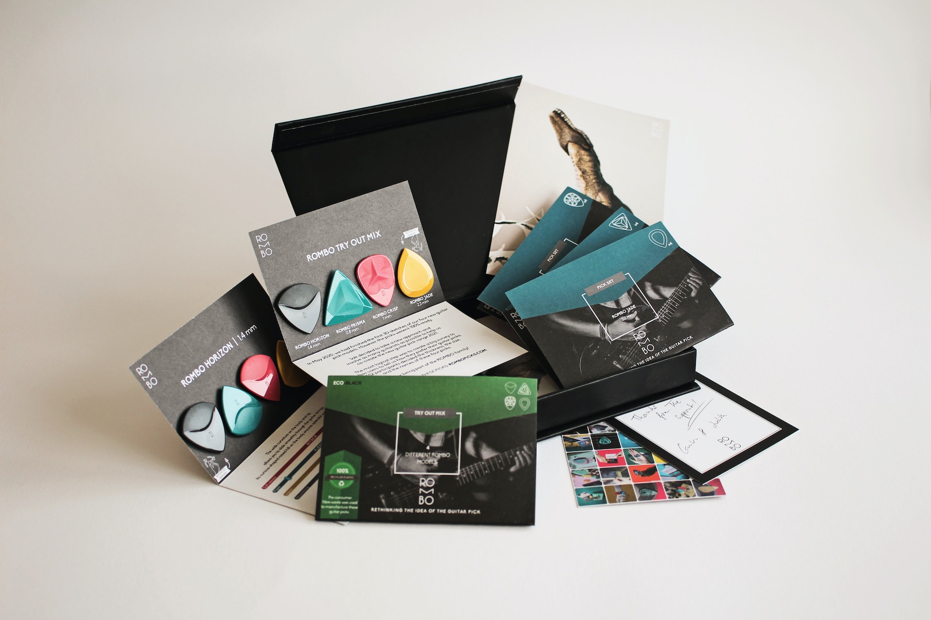 collection of small format marketing materials for guitar picks